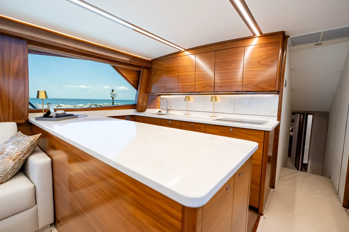 The galley, with teak cabinetry, sink and preparation counter