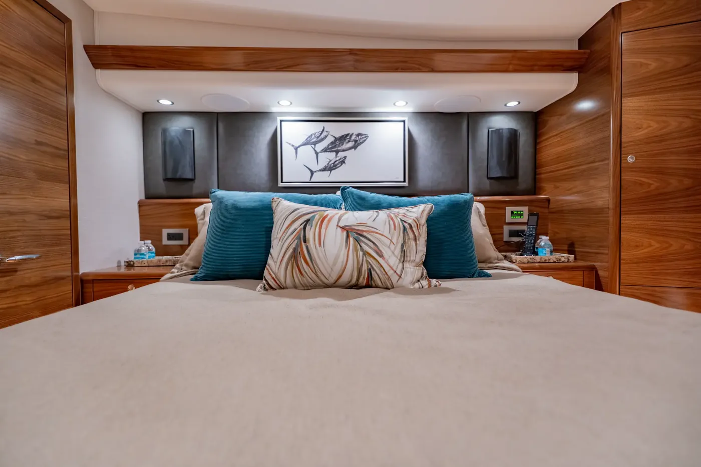 The master stateroom with an island berth and teak cabinetry